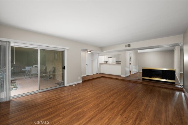 unfurnished living room featuring hardwood / wood-style floors