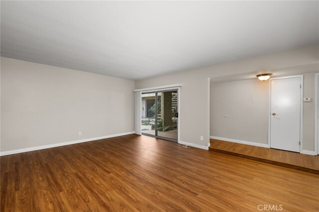 unfurnished room featuring hardwood / wood-style floors