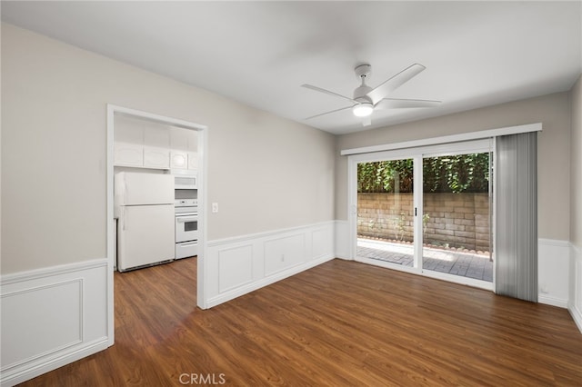 unfurnished room with ceiling fan and dark hardwood / wood-style floors