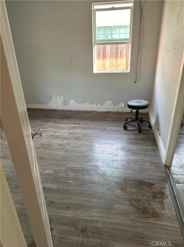 spare room with hardwood / wood-style floors