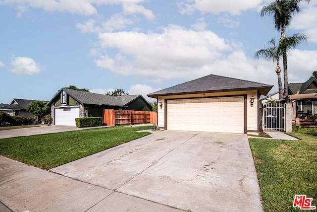 view of front of house featuring a garage and a front yard