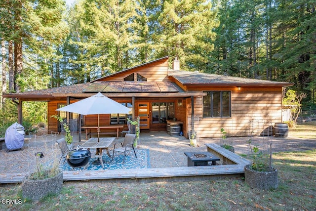 view of patio / terrace with a fire pit