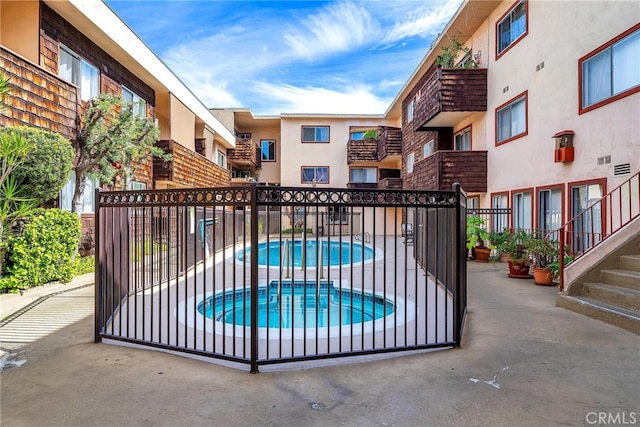 view of gate with a patio