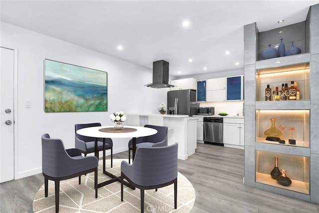 dining room with light hardwood / wood-style floors