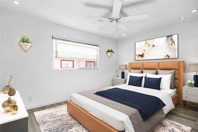 bedroom featuring ceiling fan and dark hardwood / wood-style floors