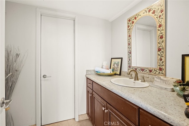 bathroom with tile patterned floors and vanity