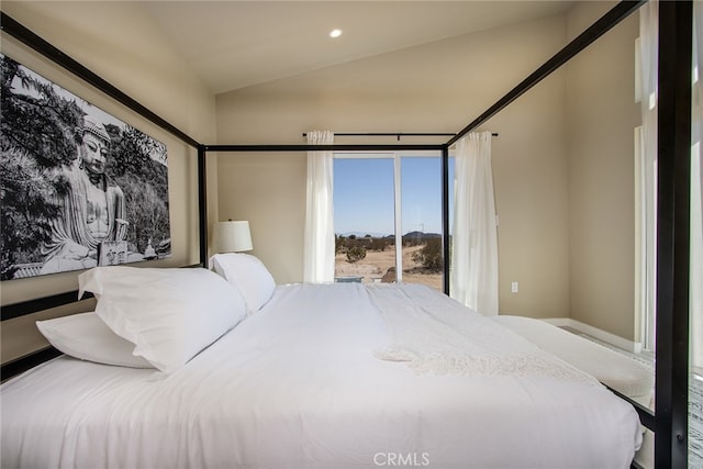 bedroom with lofted ceiling