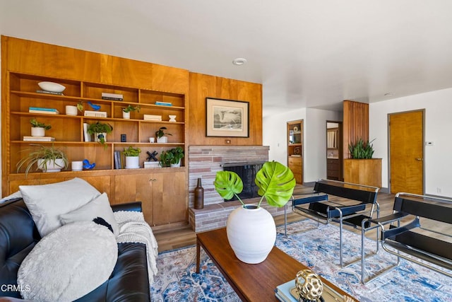 living room with a fireplace and hardwood / wood-style flooring