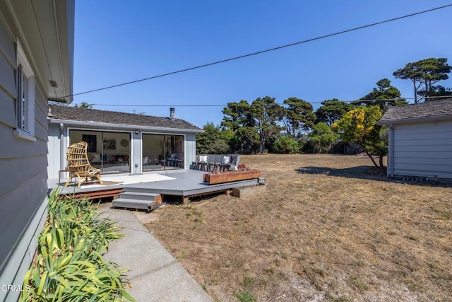 view of yard with a wooden deck