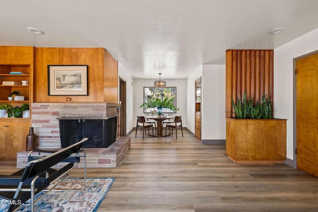 living room with a fireplace and hardwood / wood-style floors