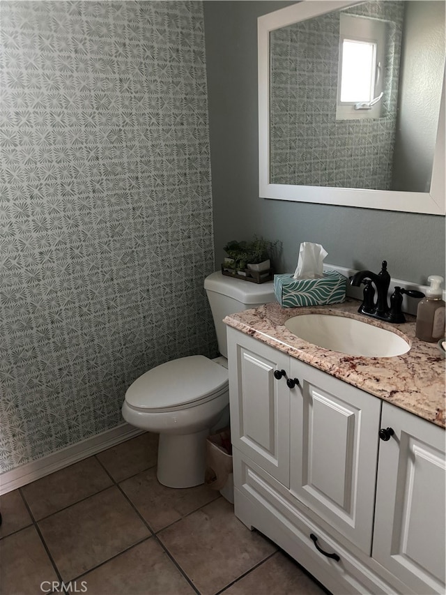 bathroom with tile patterned floors, vanity, and toilet