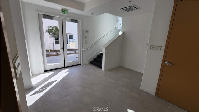 tiled entrance foyer with french doors