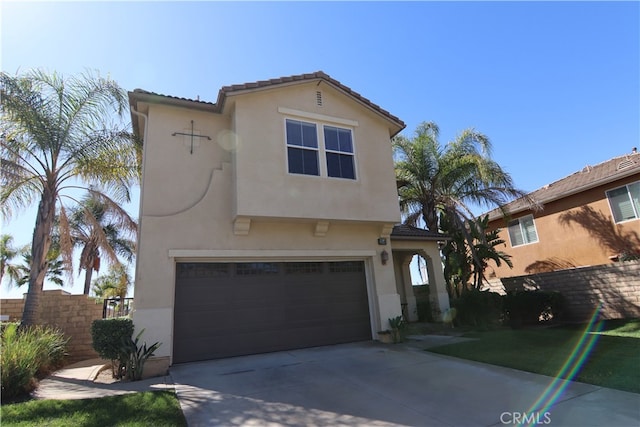 mediterranean / spanish-style home featuring a garage