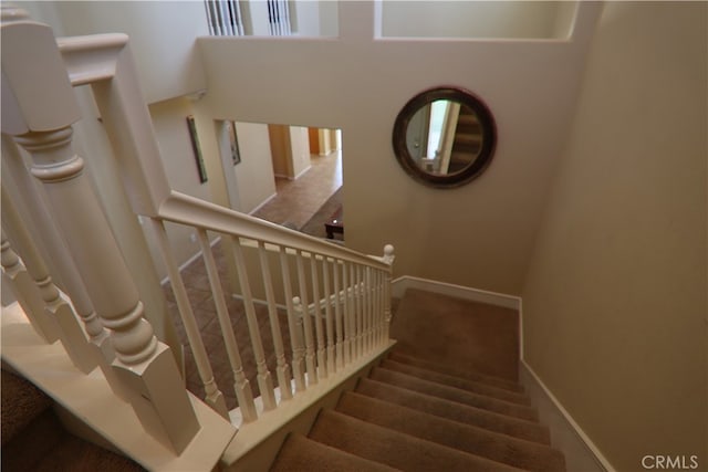 stairs featuring carpet