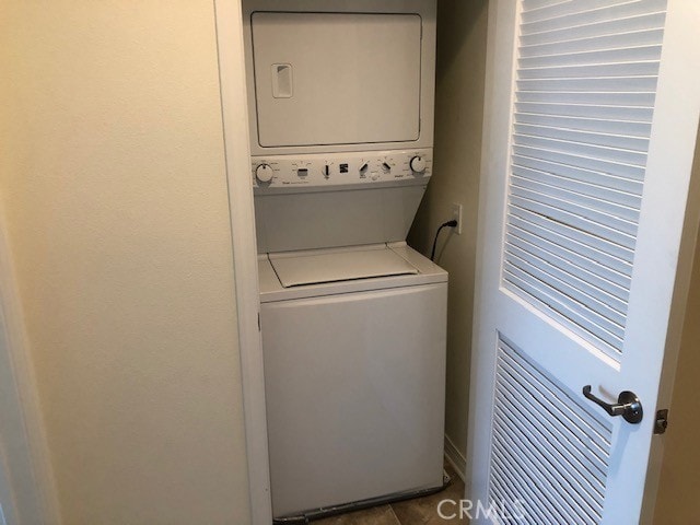 laundry area featuring stacked washing maching and dryer