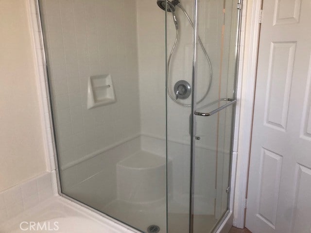 bathroom featuring walk in shower