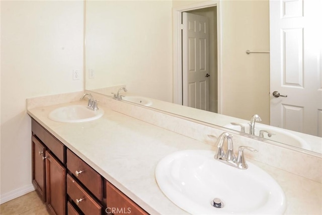 bathroom with tile patterned flooring and a sink