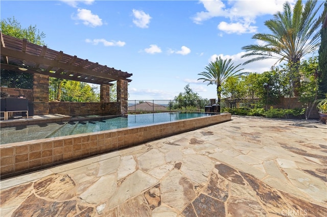 view of swimming pool featuring a pergola and a patio area