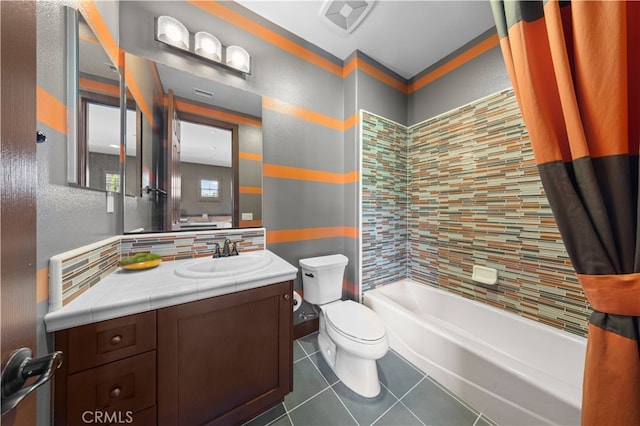 full bathroom featuring backsplash, vanity, toilet, and shower / bath combo with shower curtain