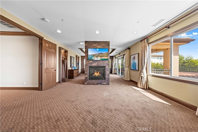 unfurnished living room featuring carpet floors and a fireplace