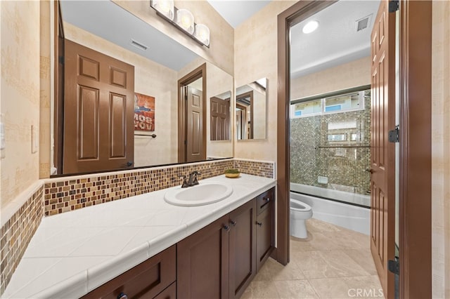 full bathroom featuring enclosed tub / shower combo, vanity, toilet, tasteful backsplash, and tile patterned flooring