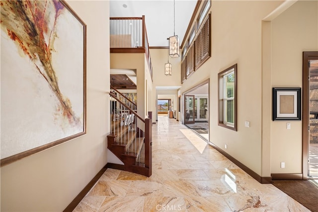 foyer entrance with a high ceiling