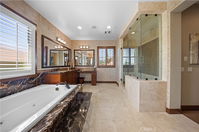 bathroom featuring vanity, shower with separate bathtub, and plenty of natural light