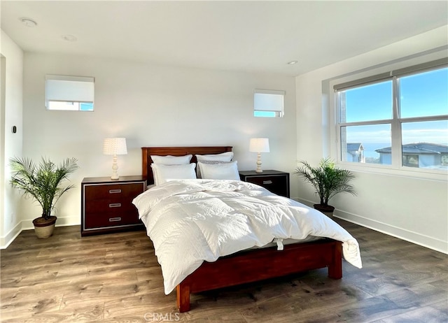 bedroom featuring dark hardwood / wood-style flooring