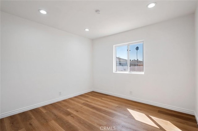 unfurnished room featuring light hardwood / wood-style flooring