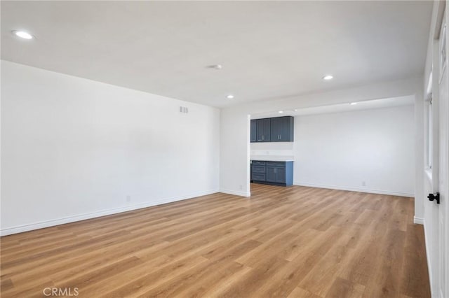 unfurnished living room featuring light wood-type flooring