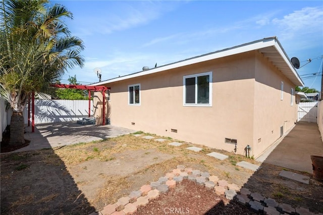 rear view of house featuring a patio