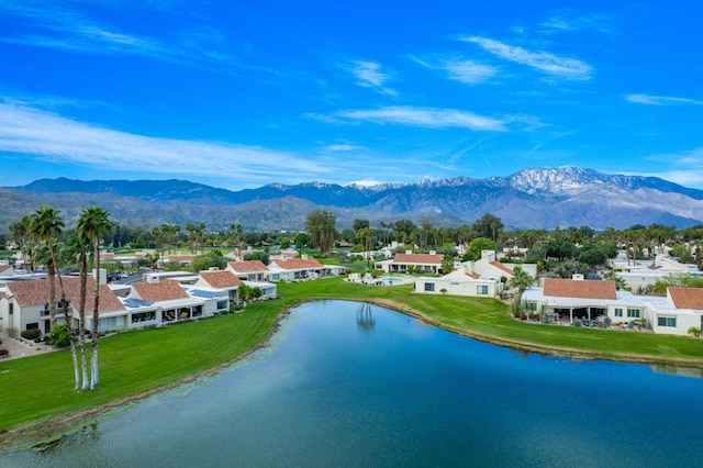 birds eye view of property featuring a water and mountain view