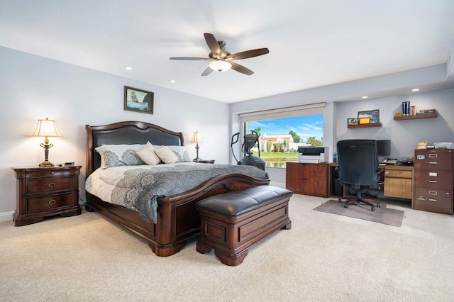 bedroom with ceiling fan and light colored carpet