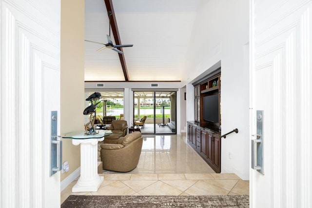 living room with ceiling fan, lofted ceiling with beams, and decorative columns