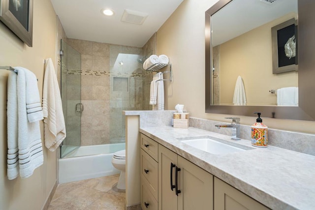 full bathroom featuring shower / bath combination with glass door, vanity, and toilet