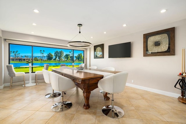 dining space featuring light tile patterned flooring