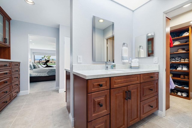 bathroom featuring tile patterned floors and vanity