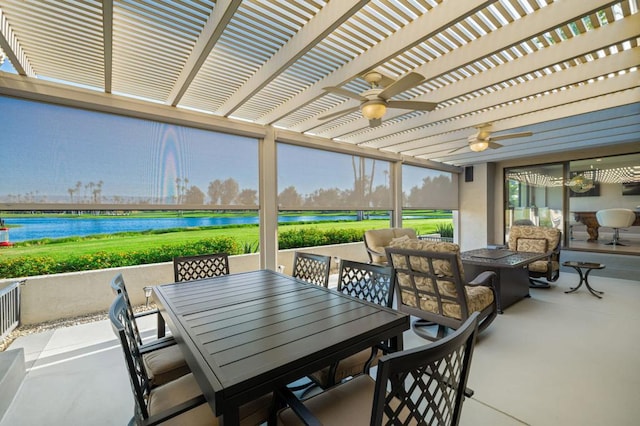 view of patio / terrace featuring ceiling fan, a pergola, and a water view