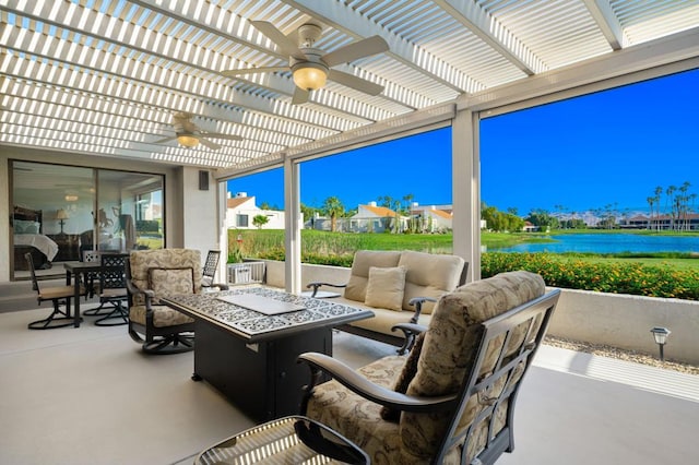 view of patio / terrace featuring a pergola, a water view, and ceiling fan