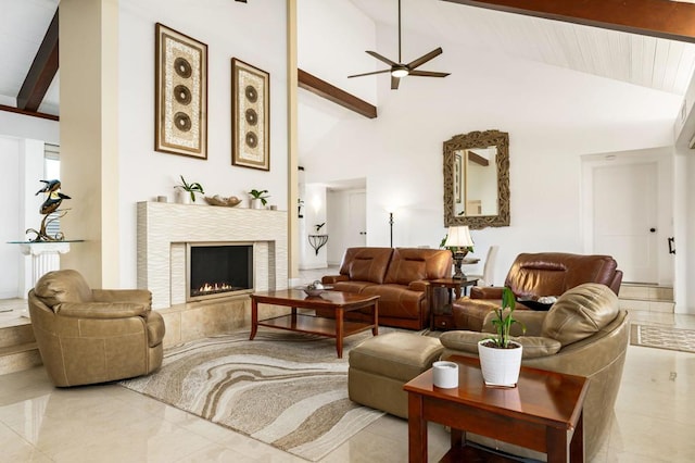 living room with light tile patterned floors, beam ceiling, ceiling fan, and high vaulted ceiling