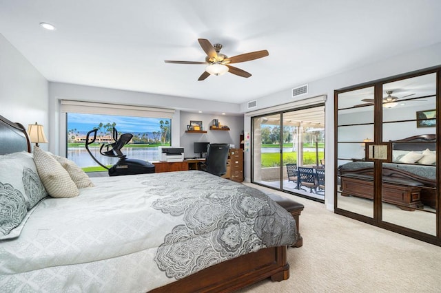 carpeted bedroom featuring multiple windows, access to exterior, and ceiling fan