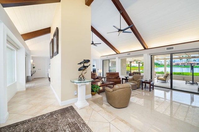 living room featuring ceiling fan, beamed ceiling, light tile patterned flooring, high vaulted ceiling, and a water view