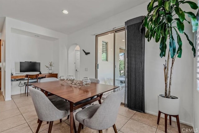 dining area with light tile patterned floors