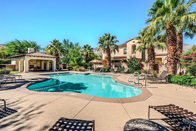 view of pool featuring a patio area