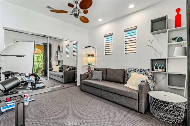 living room with carpet floors and ceiling fan