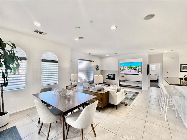 dining area with light tile patterned floors