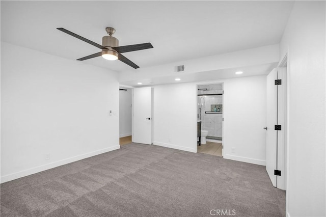 interior space featuring ceiling fan and light carpet