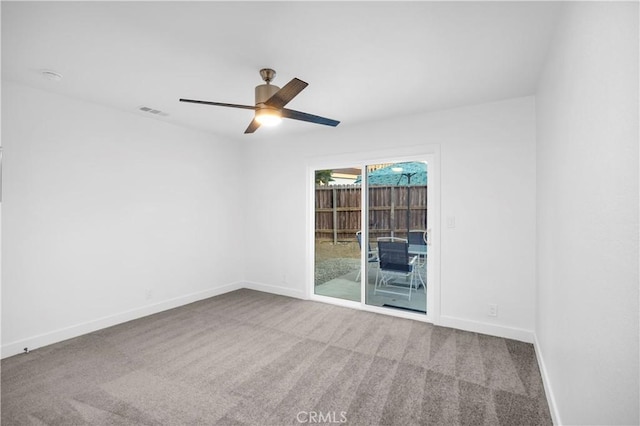 unfurnished room featuring ceiling fan and carpet floors