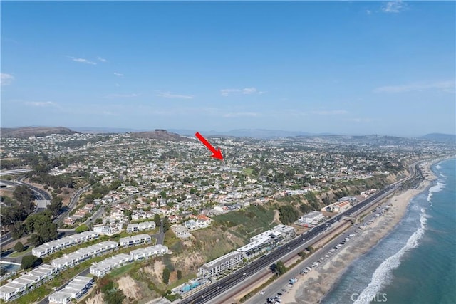 aerial view featuring a water view and a beach view