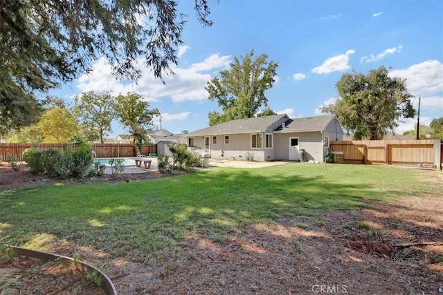 view of yard featuring a fenced in pool and a patio